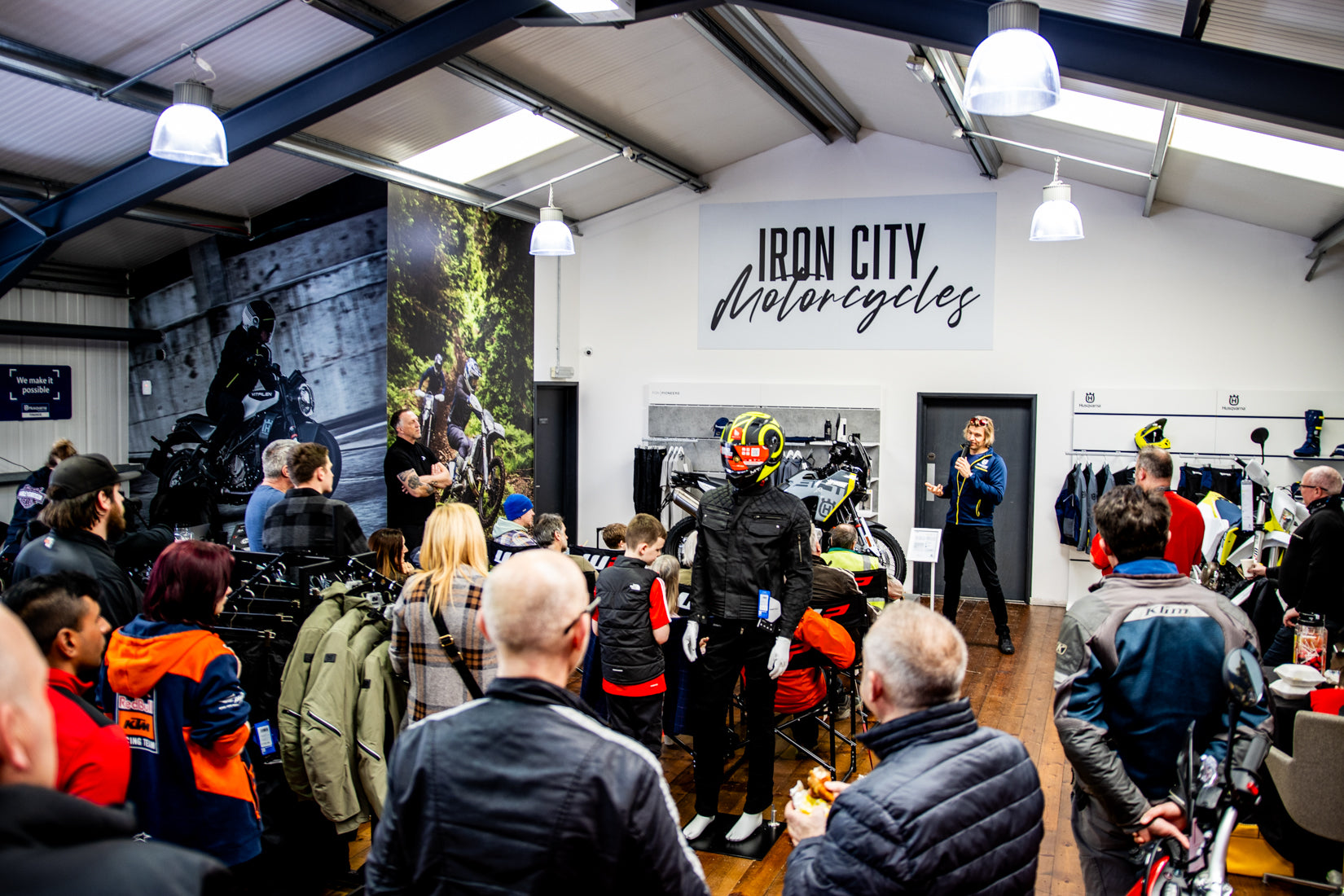 Customers and staff inside the Iron City Motorcycles showroom